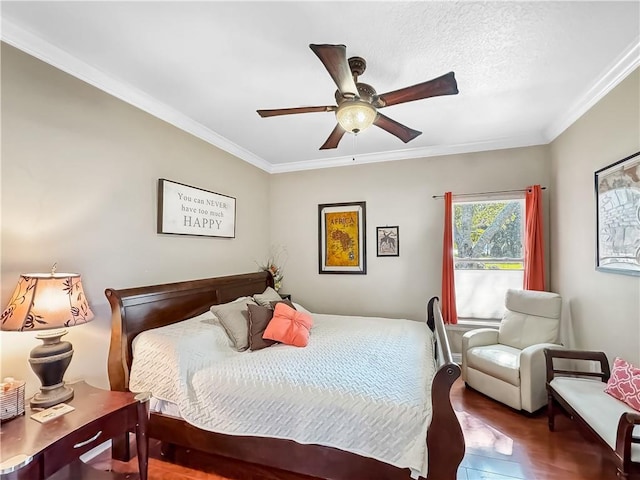 bedroom featuring crown molding, hardwood / wood-style floors, and ceiling fan