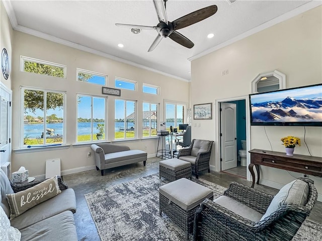 living room featuring ceiling fan and ornamental molding