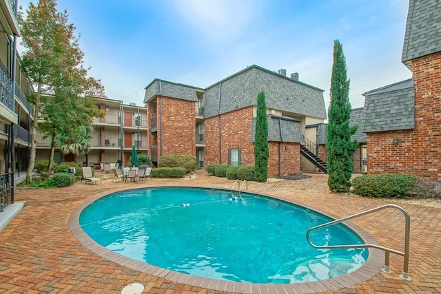 view of pool featuring a patio