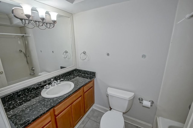 bathroom with vanity, tile patterned flooring, and toilet