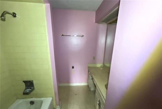 bathroom featuring vanity and tiled shower / bath combo