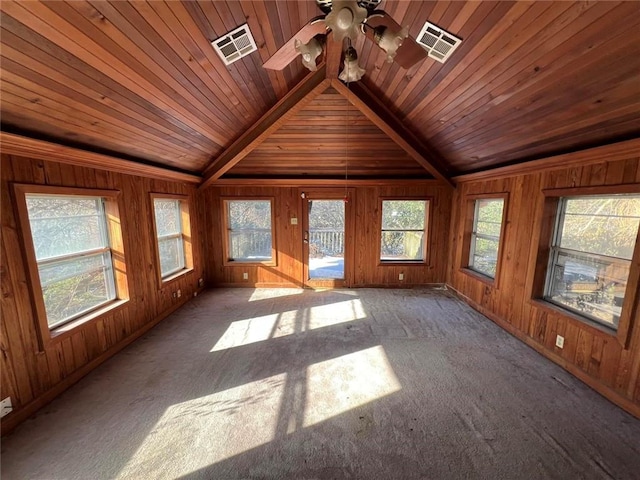 interior space featuring wood ceiling, lofted ceiling with beams, and ceiling fan