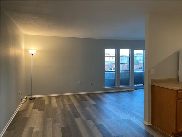 spare room featuring dark hardwood / wood-style floors