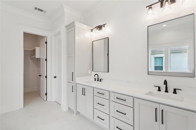 bathroom with vanity and ornamental molding