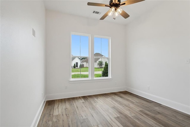 unfurnished room featuring ceiling fan and light wood-type flooring