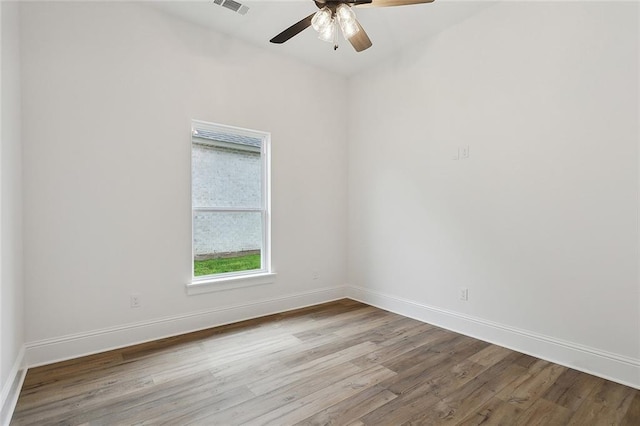 unfurnished room featuring ceiling fan and light wood-type flooring