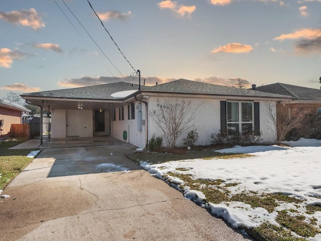 view of front of property featuring a carport