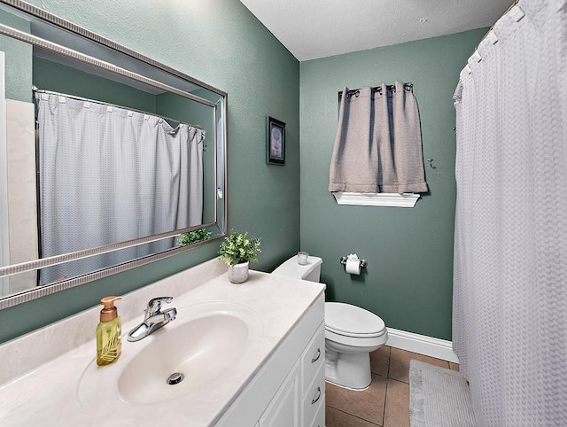 bathroom featuring vanity, a shower with shower curtain, tile patterned floors, and toilet