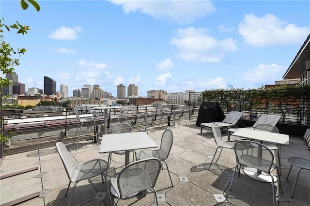 view of patio / terrace featuring a city view