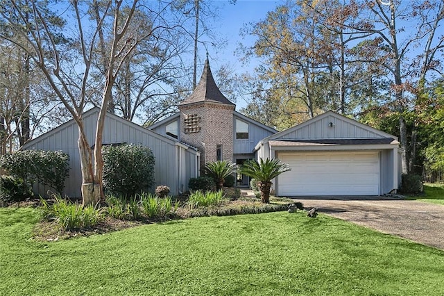 view of front of property with a garage and a front yard