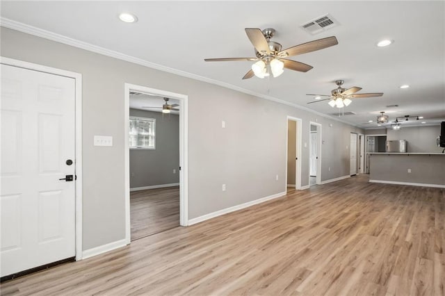 unfurnished living room featuring light hardwood / wood-style flooring and ornamental molding