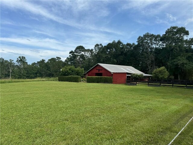 17120 Kat Kaw Rd, Franklinton, LA 70438 - view of yard with an outbuilding and fence