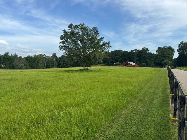 17120 Kat Kaw Rd, Franklinton, LA 70438 - view of yard featuring a rural view, a view of trees, an outdoor structure, and fence