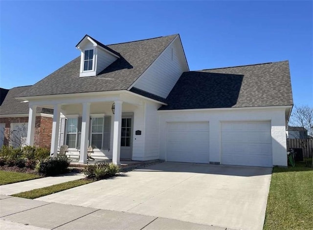 view of front of home featuring a porch and a garage