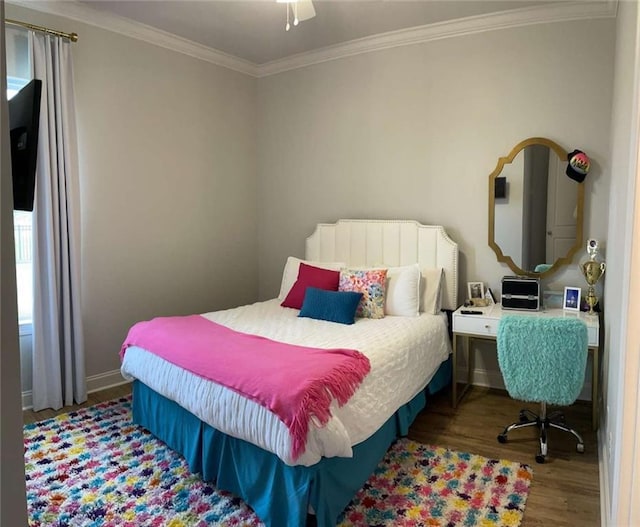 bedroom with ornamental molding and hardwood / wood-style floors