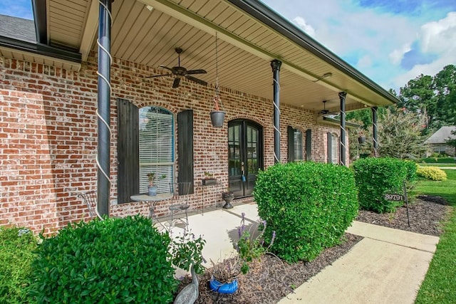 entrance to property featuring ceiling fan and covered porch