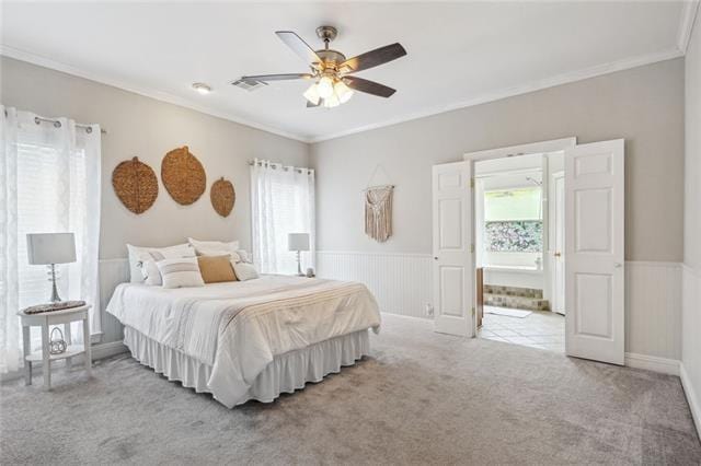 bedroom with multiple windows, crown molding, light colored carpet, and ceiling fan