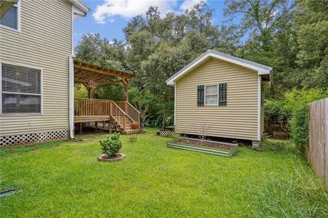 view of yard featuring a pergola and a deck