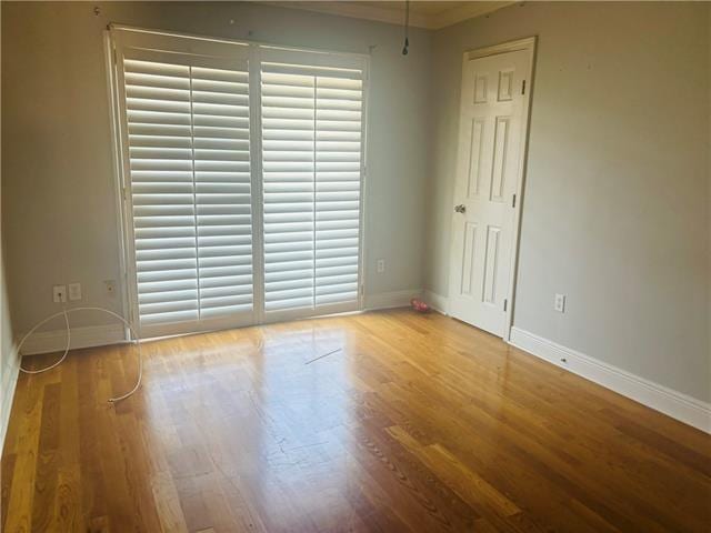 7110 Camberley Dr, New Orleans, LA 70128 - unfurnished room featuring baseboards and wood finished floors