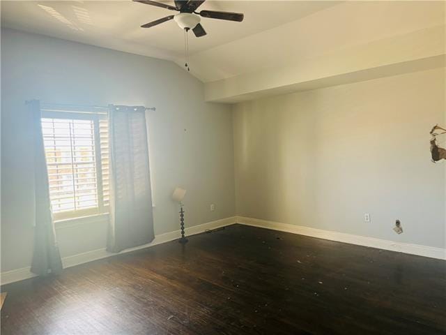 7110 Camberley Dr, New Orleans, LA 70128 - empty room featuring wood finished floors, a ceiling fan, vaulted ceiling, and baseboards