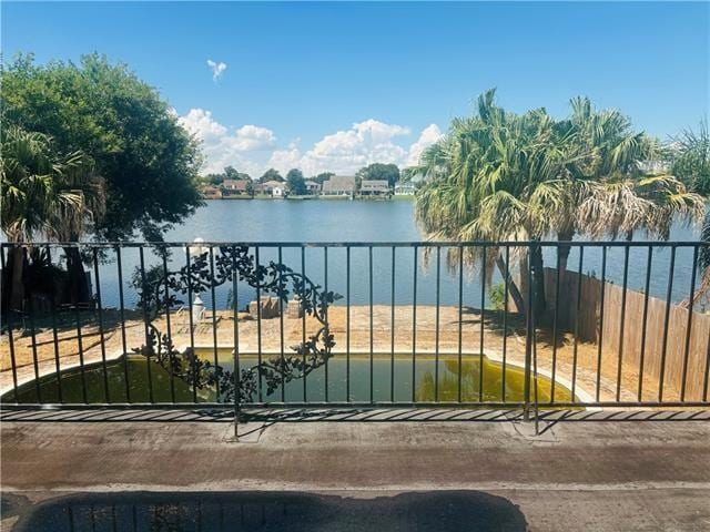 7110 Camberley Dr, New Orleans, LA 70128 - gate with a water view and fence