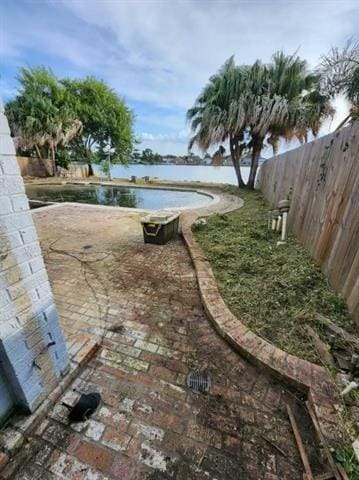 7110 Camberley Dr, New Orleans, LA 70128 - view of yard featuring fence and a water view