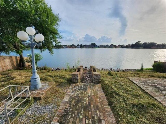 7110 Camberley Dr, New Orleans, LA 70128 - dock featuring a water view and fence