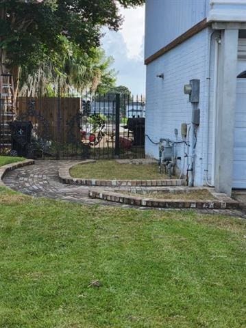7110 Camberley Dr, New Orleans, LA 70128 - view of yard with a garage