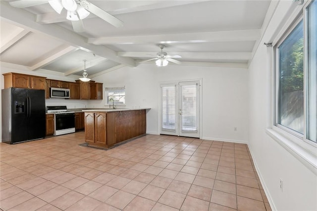 kitchen with vaulted ceiling with beams, gas range gas stove, light tile patterned floors, black fridge with ice dispenser, and kitchen peninsula