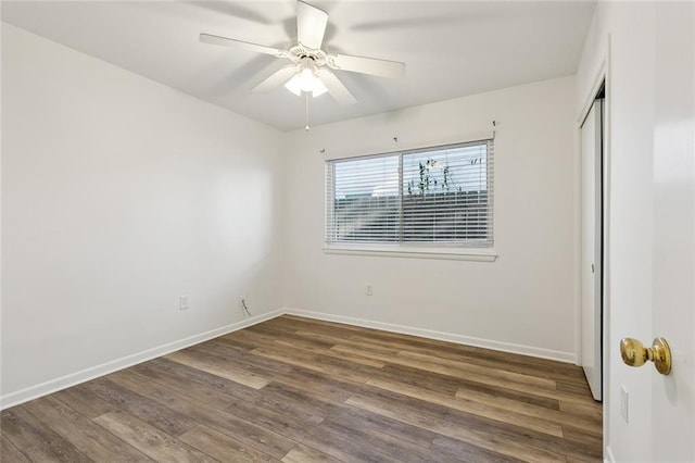 unfurnished bedroom featuring hardwood / wood-style flooring and ceiling fan