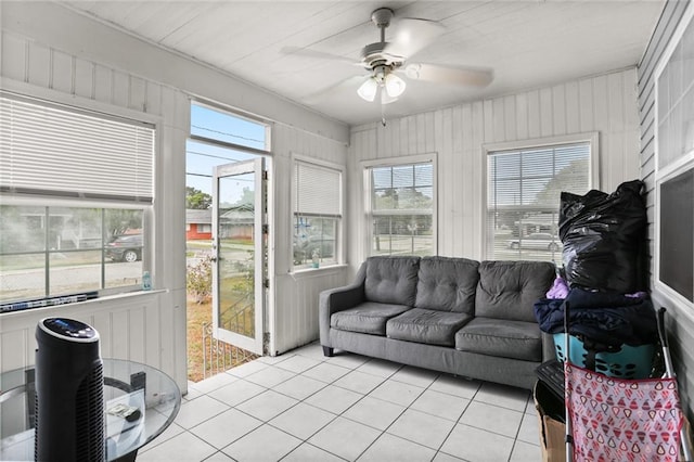 sunroom / solarium with a wealth of natural light and ceiling fan