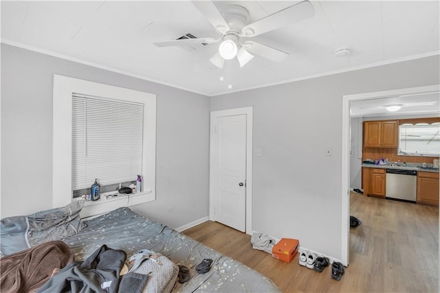 bedroom featuring ornamental molding, ceiling fan, and light wood-type flooring