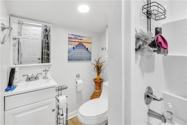 bathroom with vanity, hardwood / wood-style floors, toilet, and a shower with shower curtain