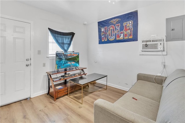 interior space featuring hardwood / wood-style flooring, electric panel, and a wall unit AC