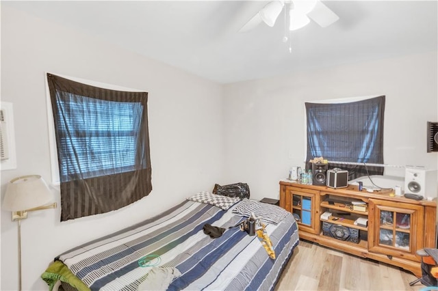 bedroom featuring ceiling fan and light hardwood / wood-style floors