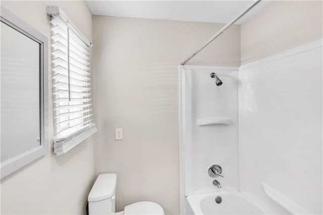 bathroom with shower / tub combination and toilet