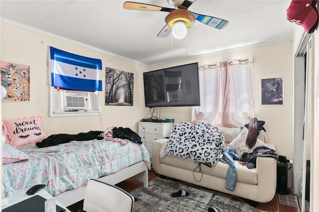 bedroom with cooling unit, crown molding, and wood-type flooring