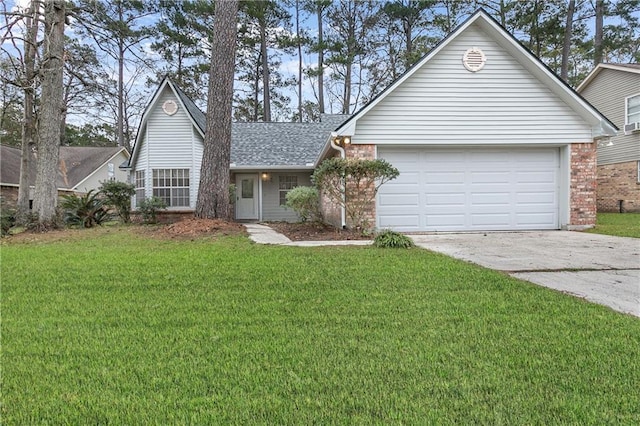 view of front of home with a garage and a front lawn