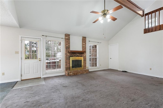 unfurnished living room featuring ceiling fan, high vaulted ceiling, carpet, a brick fireplace, and beamed ceiling