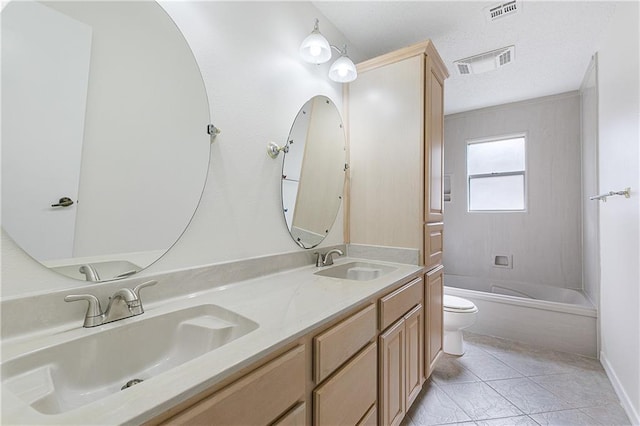 full bathroom featuring tile patterned flooring, vanity, bathing tub / shower combination, and toilet