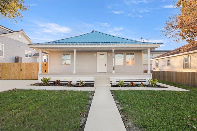 view of front of house featuring a front yard and covered porch