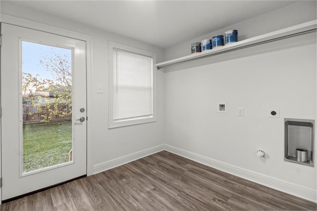 washroom featuring hardwood / wood-style flooring, washer hookup, hookup for an electric dryer, and hookup for a gas dryer