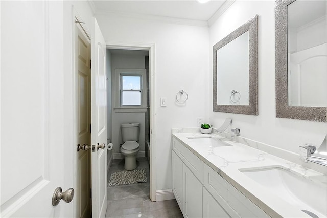 bathroom featuring crown molding, tile patterned floors, vanity, and toilet