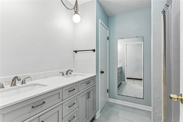 bathroom with vanity and tile patterned floors