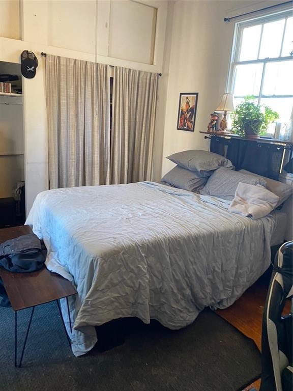 bedroom with wood-type flooring