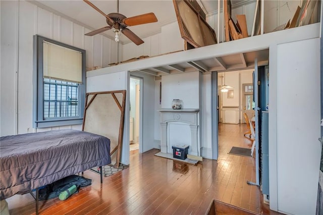 bedroom featuring wood-type flooring and ceiling fan