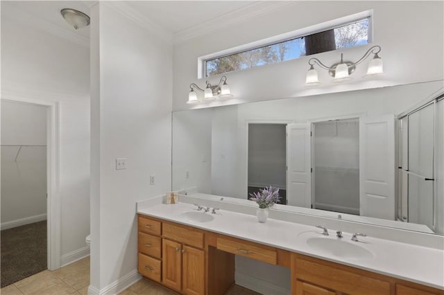 bathroom featuring a shower with shower door, ornamental molding, vanity, toilet, and tile patterned floors