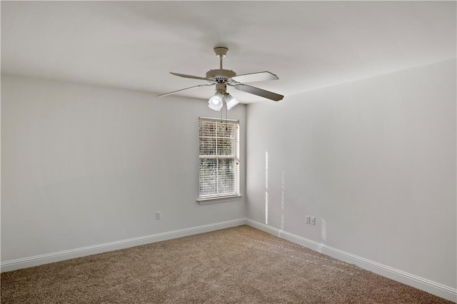 empty room with ceiling fan and carpet flooring