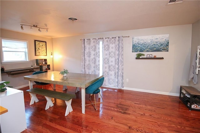 dining room with hardwood / wood-style floors