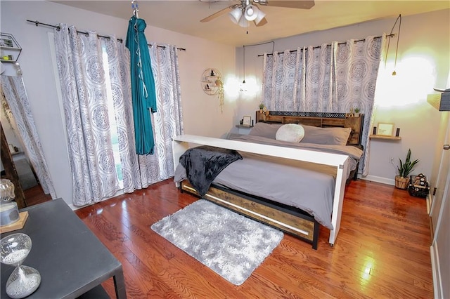 bedroom with hardwood / wood-style flooring and ceiling fan